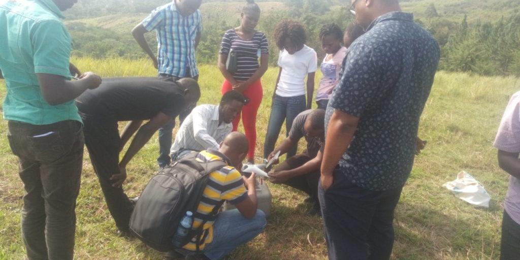 The instructor and participants assembling the drone.