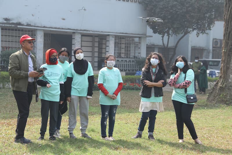 Bangladesh Flying Labs STEM Program: A group of girls fly a drone