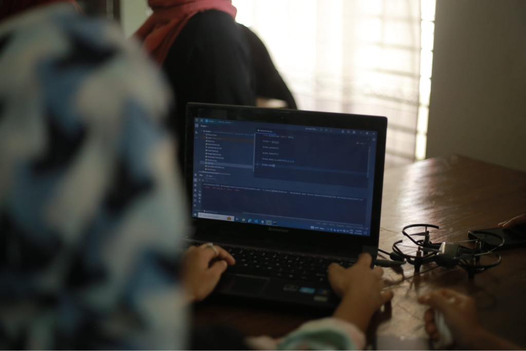 a female participant working on her laptop